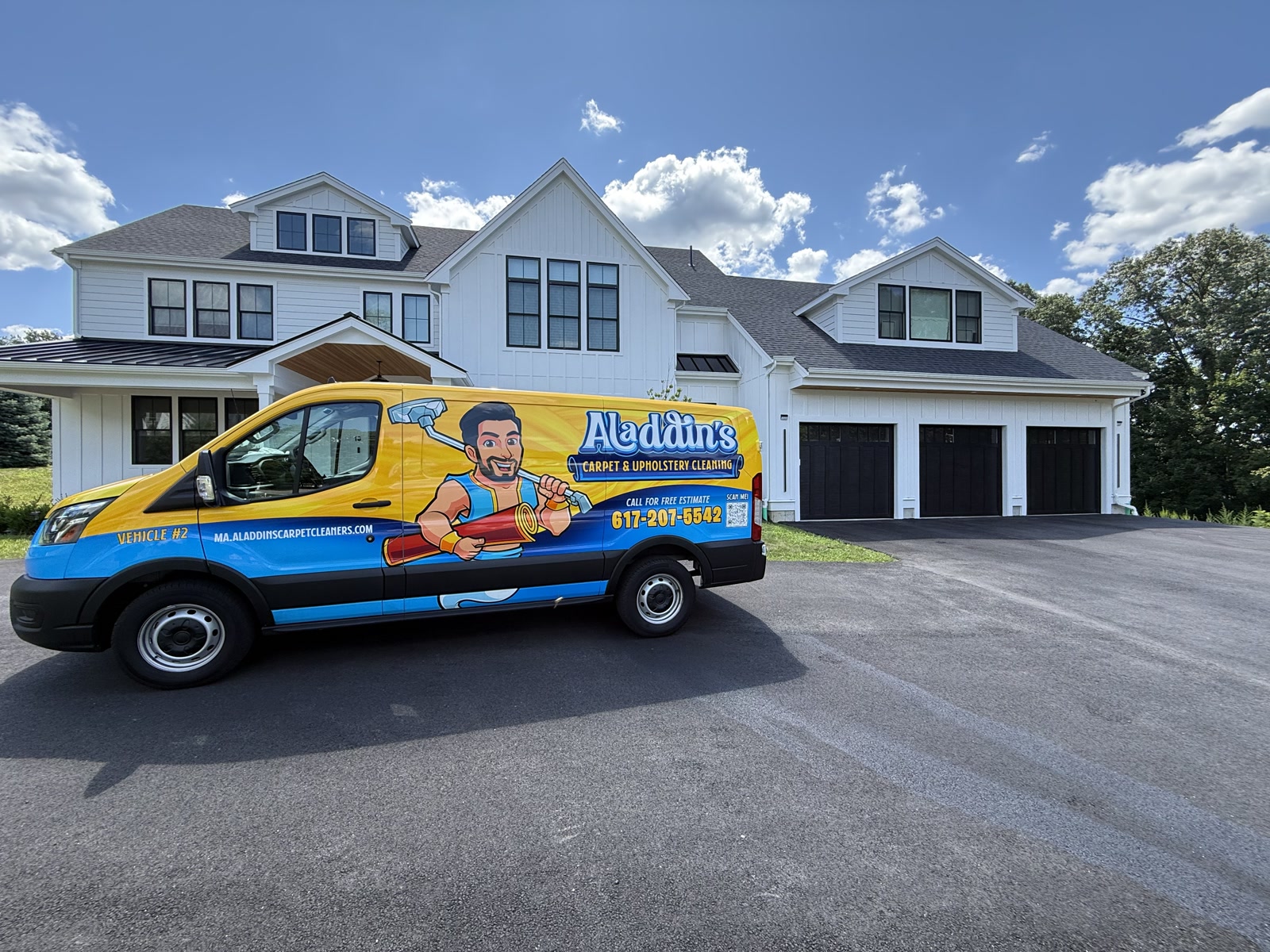 Aladdin’s Carpet Cleaning truck parked at a customer’s modern white farmhouse